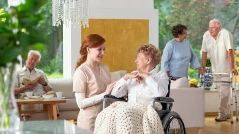 Seniors In A Luxury Living Room Of A Private Retirement