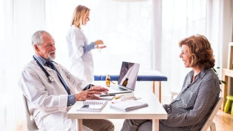 Senior doctor examining a seni